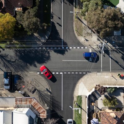 newly constructed asphalt road with cars on it